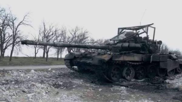 Destroyed Russian tank with a cope cage.