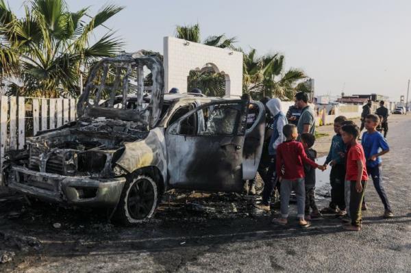 A destroyed car of World Central Kitchen on a road between Deir el-Balah and Khan Younis in the southern Gaza Strip, April 2, 2024