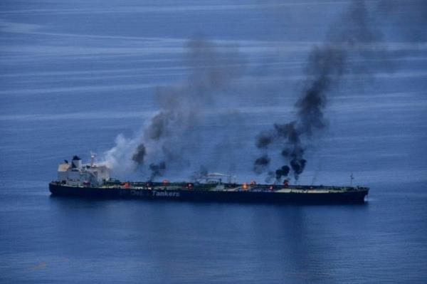 Smoke rises from ship at sea