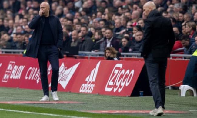 Arne Slot of Feyenoord and Erik ten Hag of Ajax look on during the Dutch Eredivisie match.